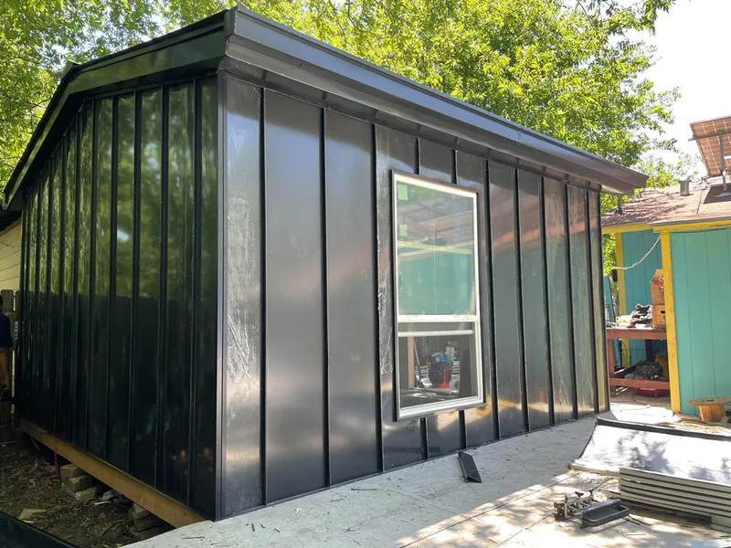 Black standing seam metal wall panels for Roof Inspection in Niagara